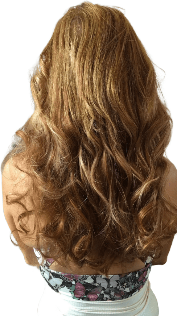 Woman with thin brown hair after getting hair extensions