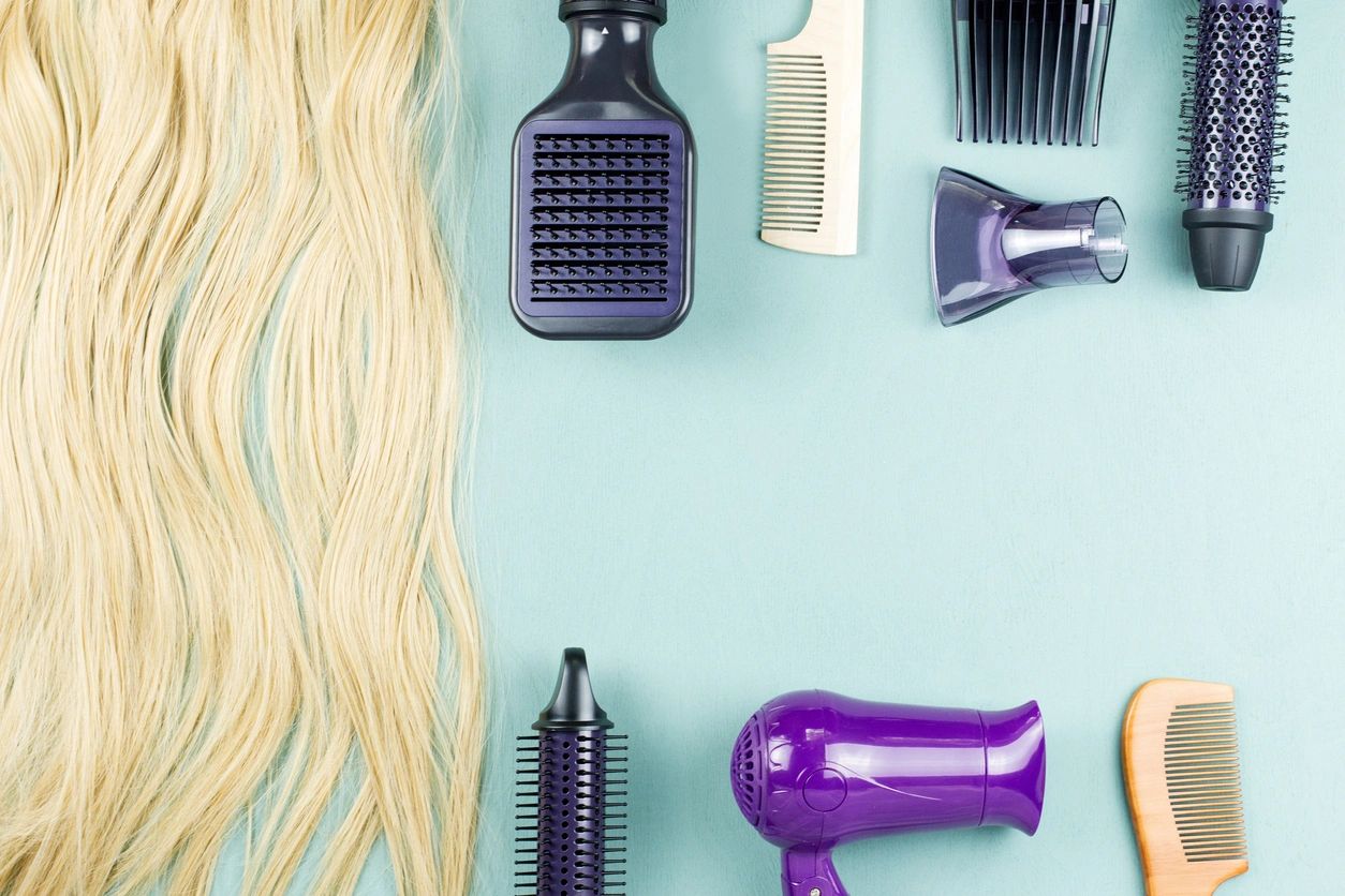 Hair care products beside blonde tresses